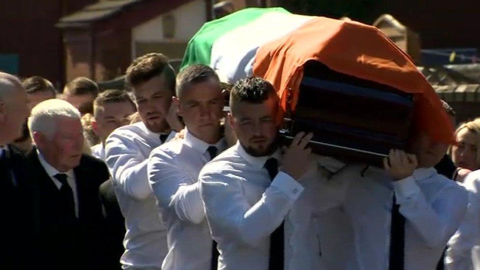 Mourners carrying the coffin of Kevin McGuigan