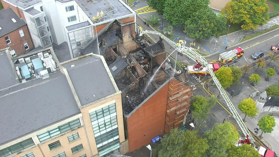 An aerial view of the damage to the top of the roof