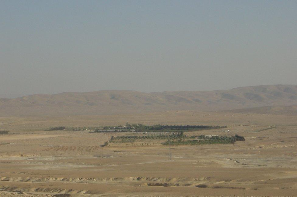 View from afar of site within the desert