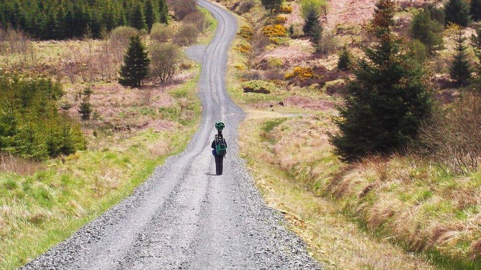 Person using Google Trekker camera