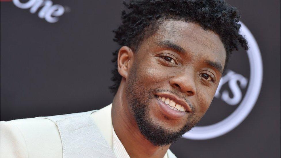 Chadwick Boseman looking at camera