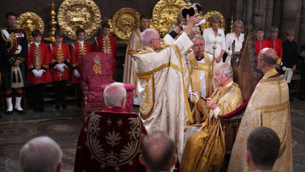 King Charles III is crowned with St Edward's Crown by The Archbishop of Canterbury during his Coronation ceremony