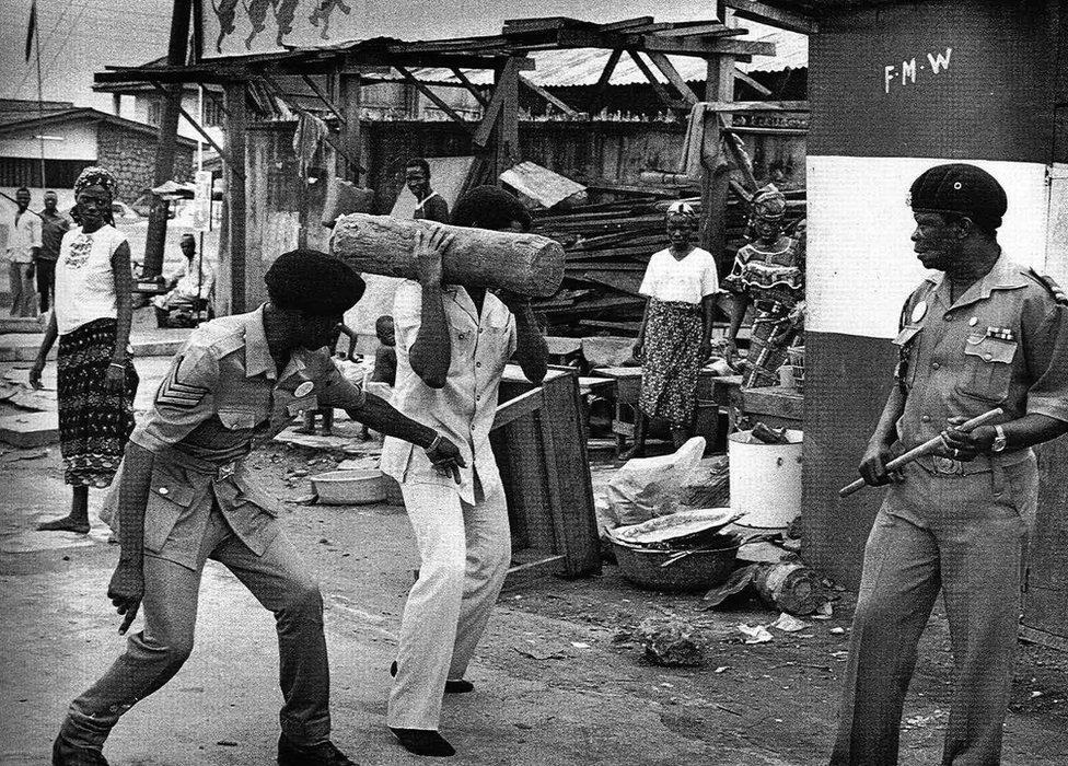 A photo by Sunmi Smart-Cole entitled: "The Arresting Officer, Judges And Executioners" - 1984, showing policemen confronting someone