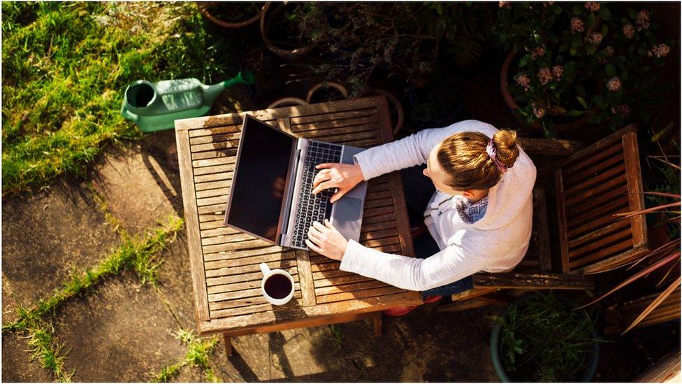 Homeworker in a garden - aerial image