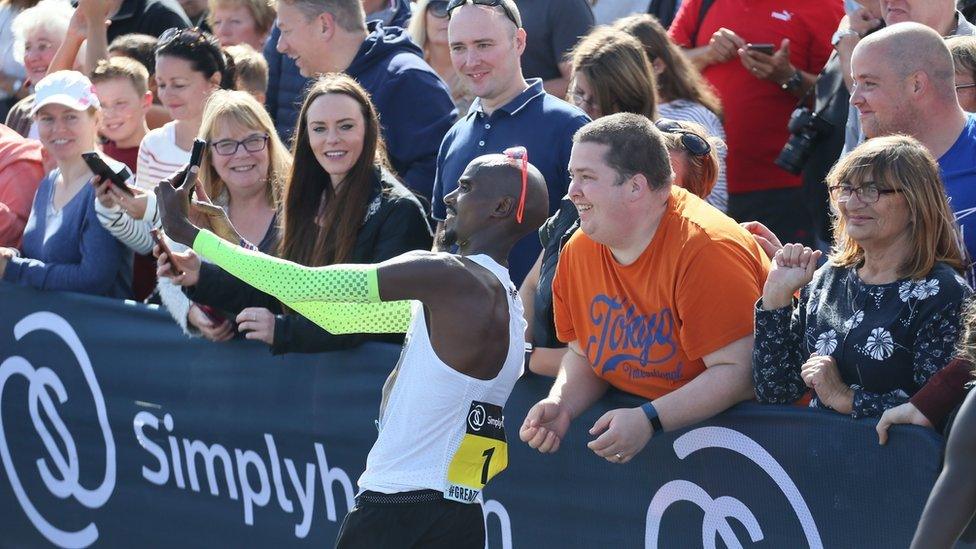 Sir Mo Farah takes a mobile phone selfie after winning the Great North Run