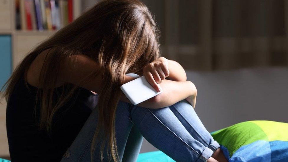 Distressed teenage girl (posed image)