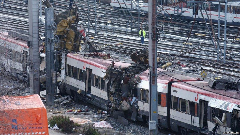 The wreckage of a train in Madrid in 2004, after terrorists detonated three bombs