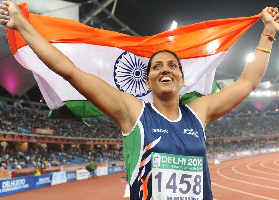 India's Krishna Poonia celebrates her gold medal during the discus women final of the Track and Field competition of the XIX Commonwealth Games on October 11, 2010 in New Delhi.