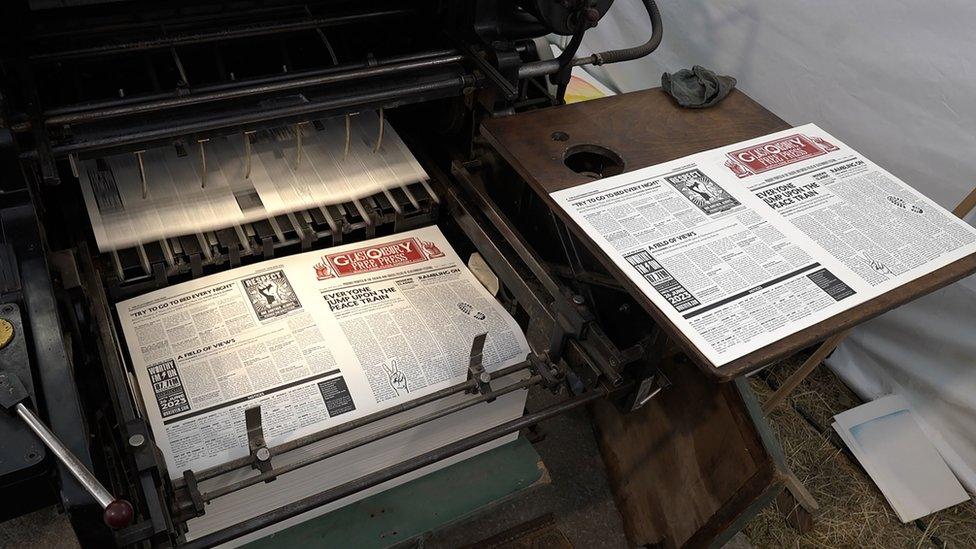 The paper is printed on site at the festival with a vintage five-tonne Heidelberg press