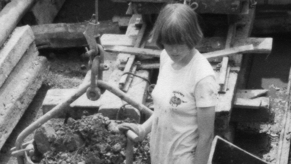 A woman restoring the canal