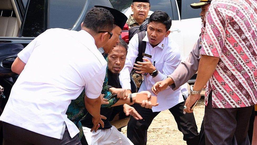 A man stabbing Indonesian Security Minister Wiranto during his visit in Pandeglang, Indonesia,