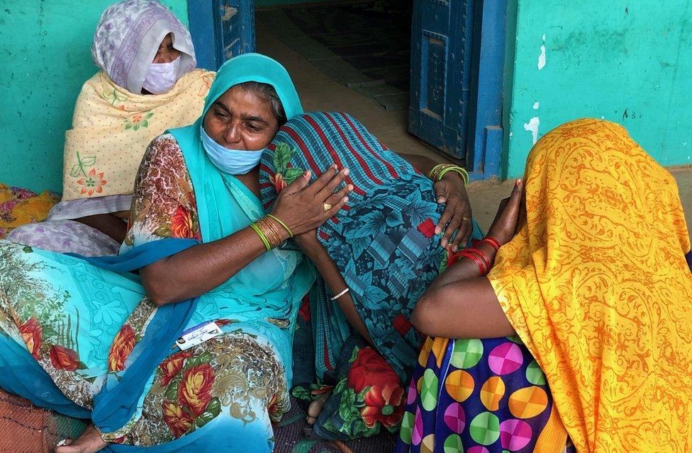 The victim's aunt consoles the 19-year-old's mother