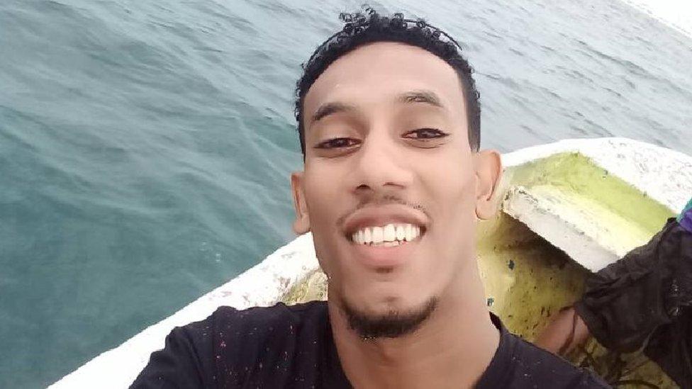 Anwar Mohamed takes a selfie in a boat