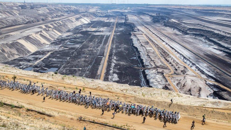 Activists walking through the Garzweiler mine