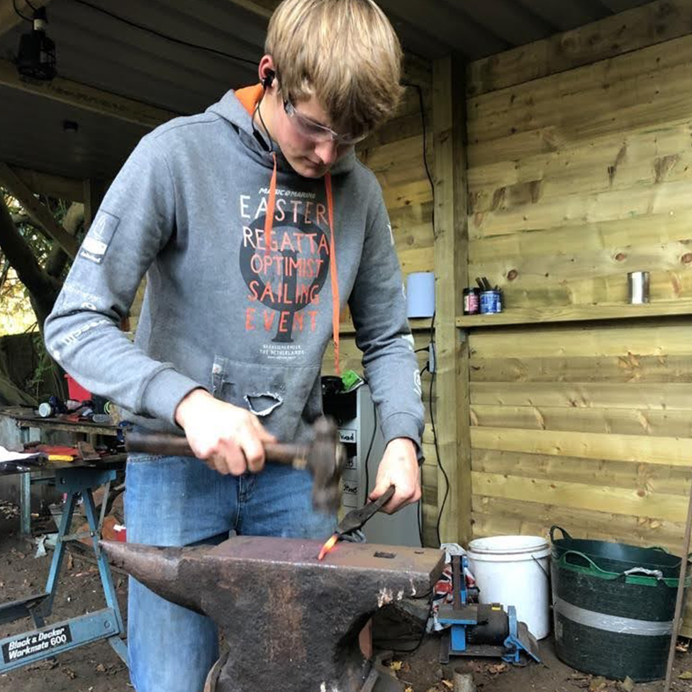 Ben using an anvil