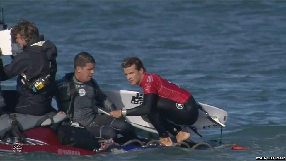 Julian Wilson being taken to safety