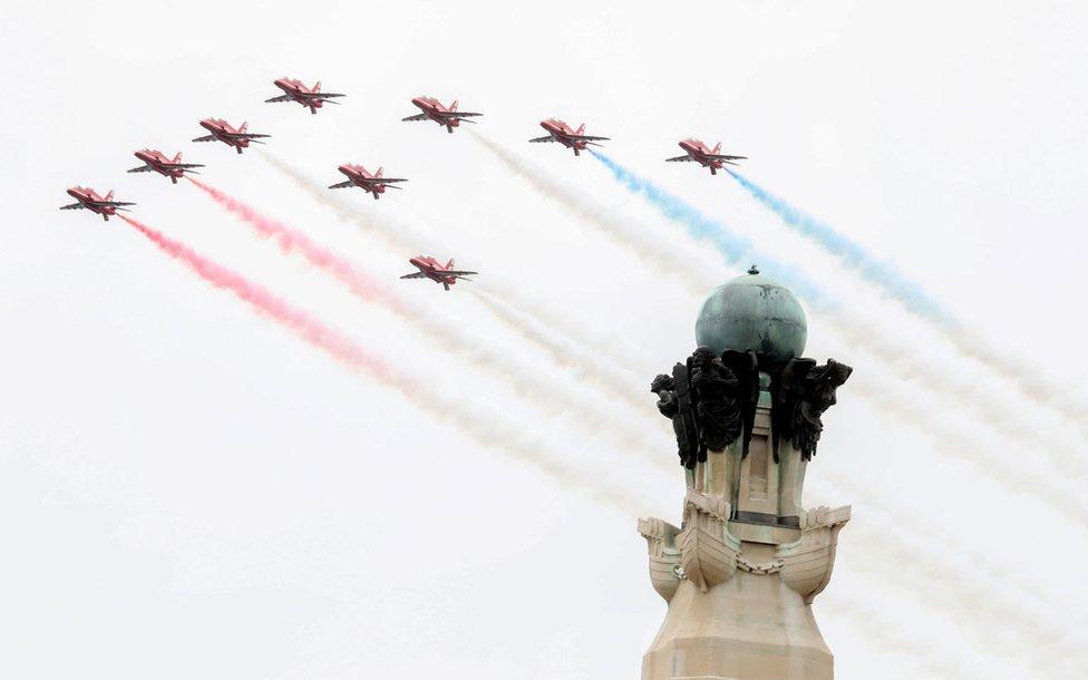 The Red Arrows perform a flypast