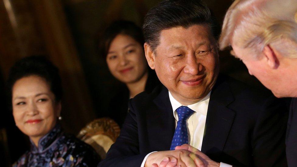 Chinese President Xi Jinping shakes hands with U.S. President Donald Trump as he is accompanied by China"s first lady Peng Liyuan during a dinner at the start of a summit between President Trump and President Xi at Trump"s Mar-a-Lago estate in West Palm Beach, Florida, U.S., April 6, 2017.