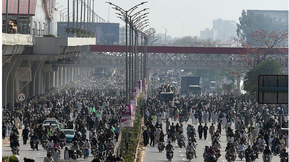 Thousands of protesters marching towards the centre of Islamabad