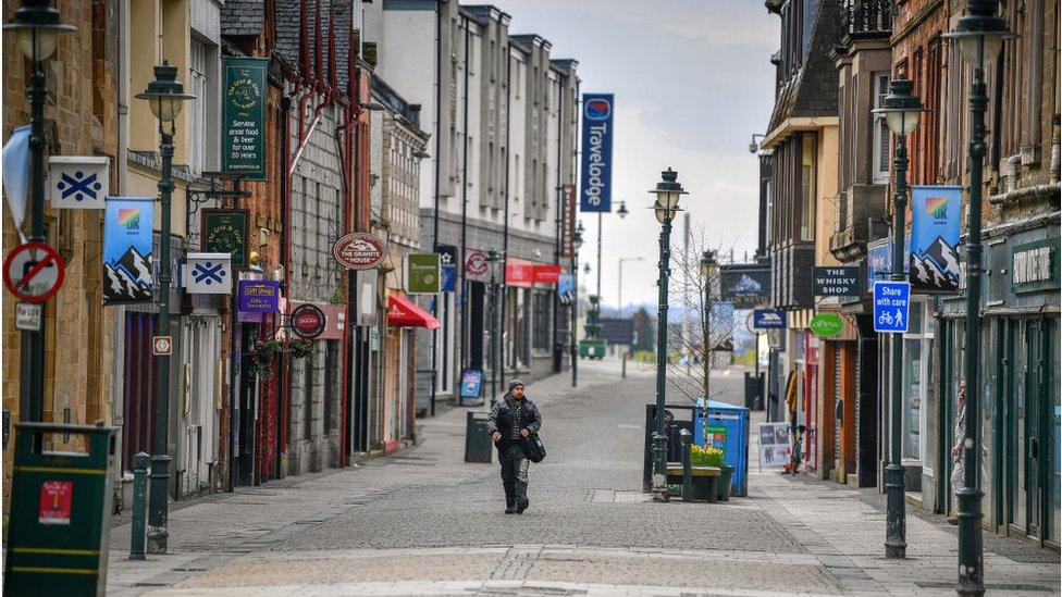 A man walks through Fort William