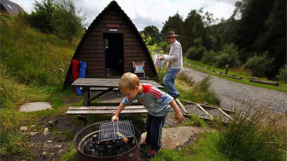 Man and boy with barbecue