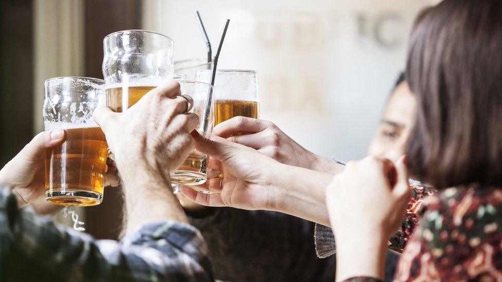 Stock image of people at a bar