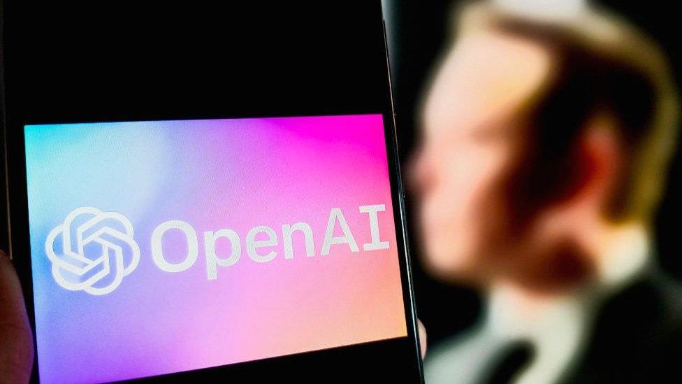 Digital illustration shows OpenAI logo displayed on a smartphone screen with a blurred image of Elon Musk in the background