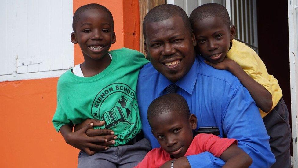 Nick Christopher poses with three of his five children