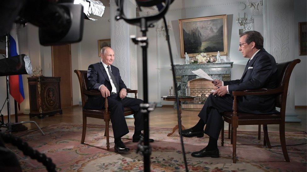 Russia's President Vladimir Putin gives an interview to Fox News Channel anchor Chris Wallace in 2018