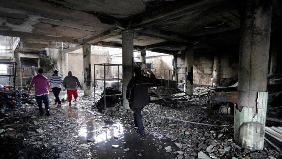 View inside a house burnt down under unclear circumstances and in which four adults and two children died, in the Carlos Marx neighbourhood, in Managua on June 16, 2018.