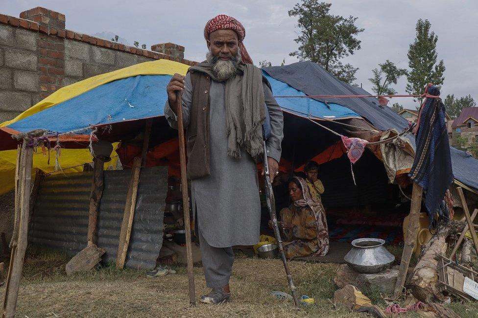 Mohammad Zubair, a disabled nomad, outside his tent on the outskirts of Srinagar.