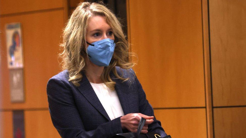 Theranos founder and former CEO Elizabeth Holmes goes through a security checkpoint as she arrives at the Robert F. Peckham Federal Building on December 17, 2021 in San Jose, California