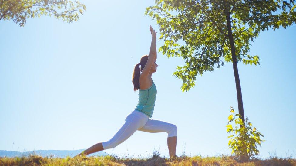 A woman exercising in the sunshine