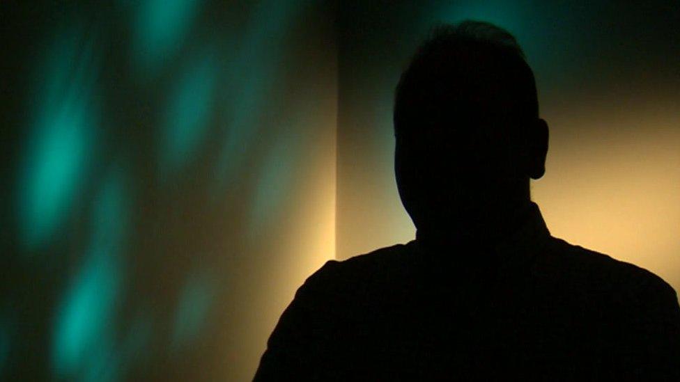 Silhouette of an adoptive parent speaking to the BBC