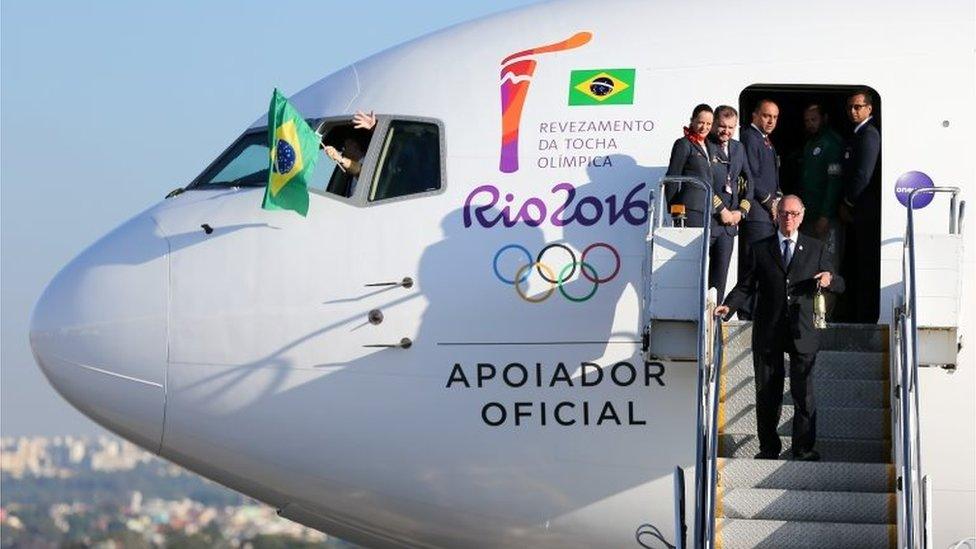 Carlos Arthur Nuzman , President of Rio 2016, steps from the plane with the Olympic flame arriving from Geneva, on May 3, 2016 in Brasilia, Brazil. The Olympic torch will pass through 329 cities from all states from the north to the south of Brazil, before arriving in Rio de Janeiro on August 5, for the lighting of the cauldron.