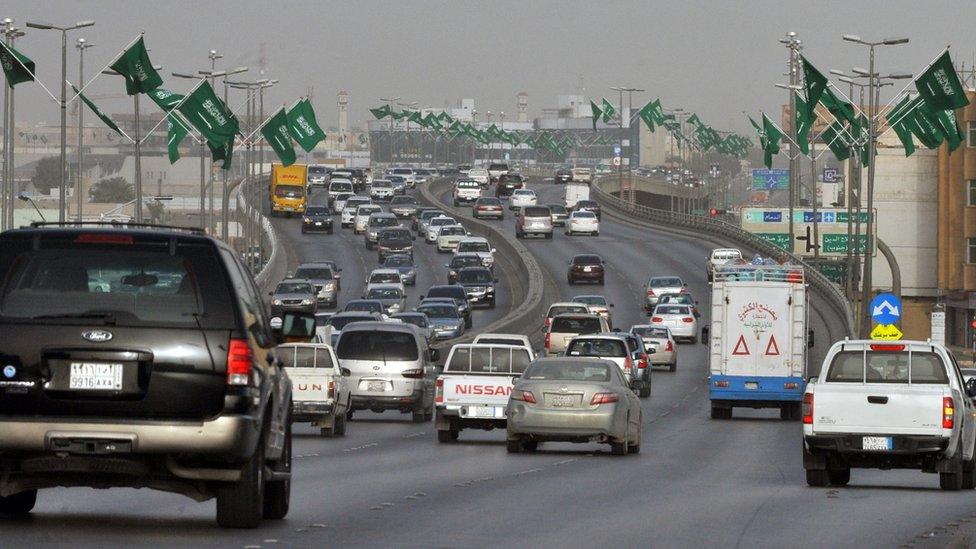 Cars drive down a highway in Riyadh