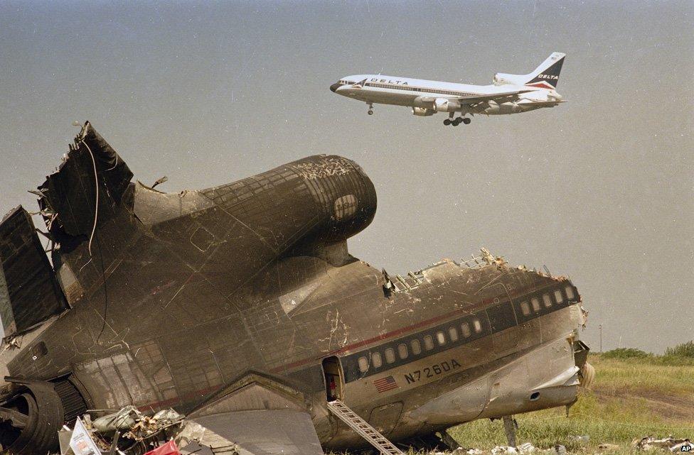 Tail section of a Delta L-1011 jetliner remains near the runway at the Dallas-Fort Worth International Airport, Aug. 3, 1985