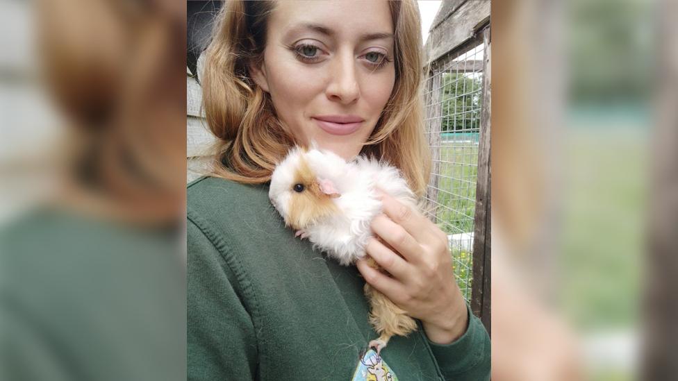 Kelly Wolmer holding a guinea pig