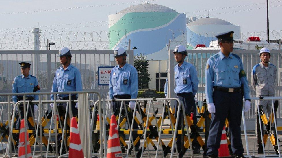 Police outside Sendai nuclear plant. 10 Aug 2015