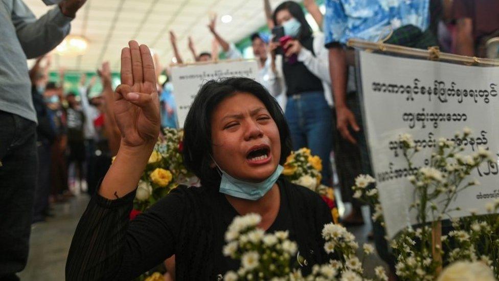 Woman at funeral of victims