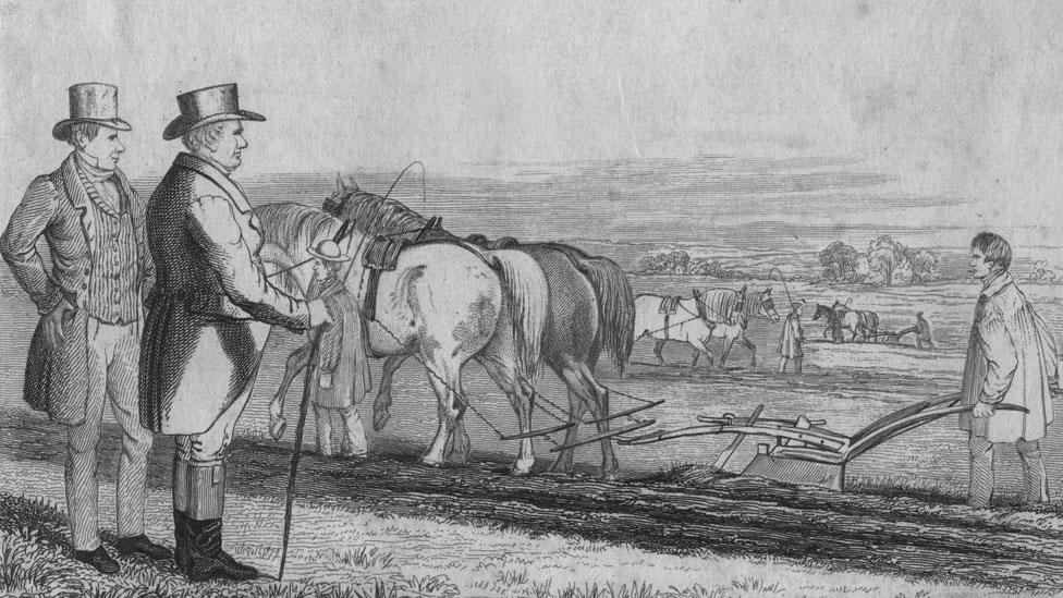 A depiction of two well-dressed men overseeing farm workers ploughing a field, circa 1820