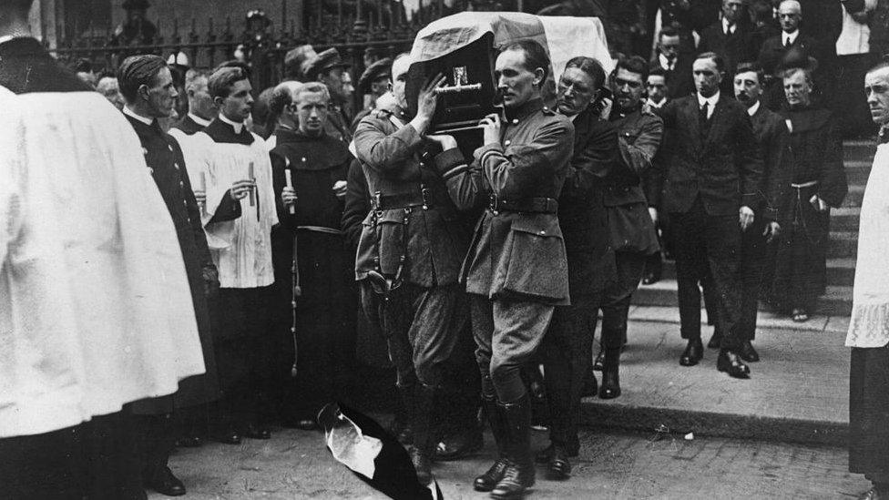 Arthur Griffith's coffin is carried by comrades including Michael Collins