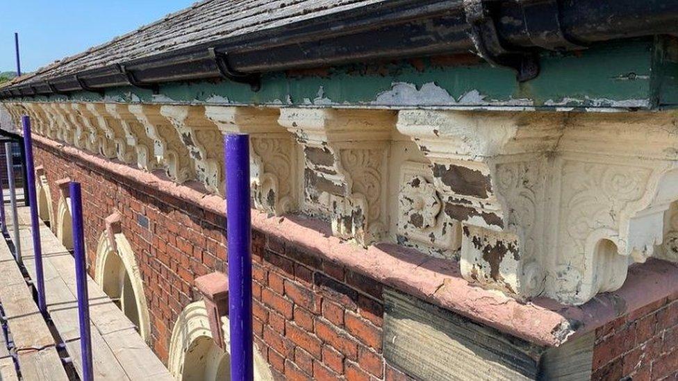 Damaged corbels on the building