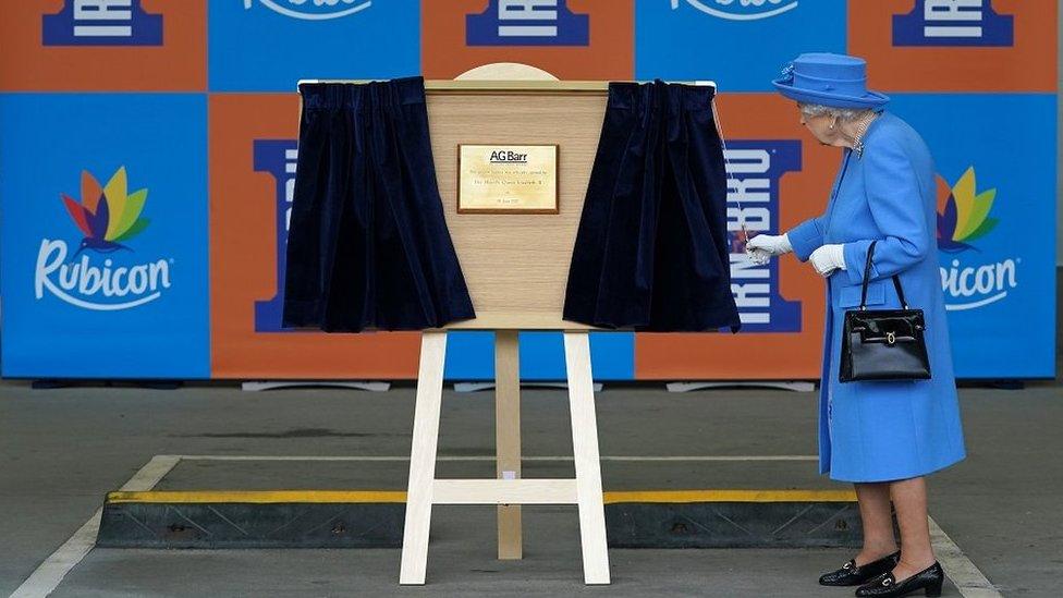 The Queen unveiling a plaque at the AG Barr factory