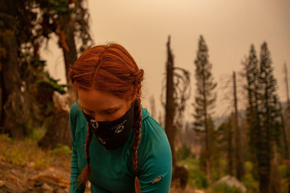 Hiker wears a buff over her head