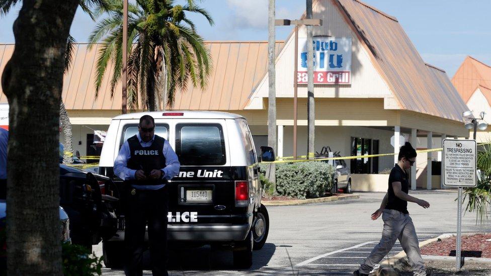 Investigators outside Club Blu in Fort Myers