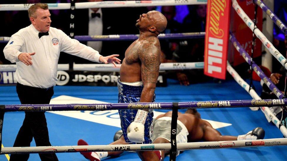 Dillian Whyte celebrates after winning against Derek Chisora