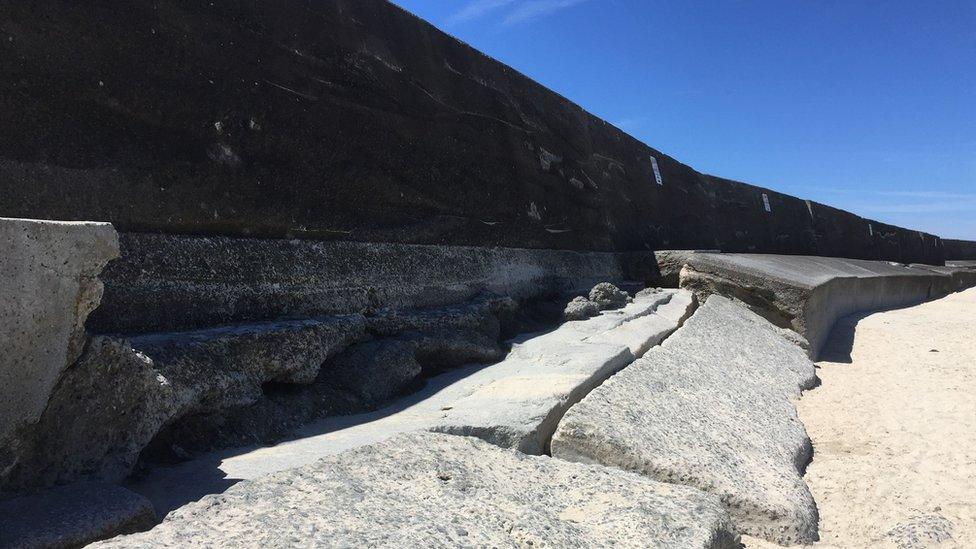 Broken section of concrete wall