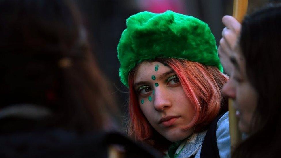 A woman wears a green hat, a colour which symbolizes the abortion rights movement, during a demonstration in favour of legalising abortion outside the Congress in Buenos Aires, Argentina, August 1, 2018