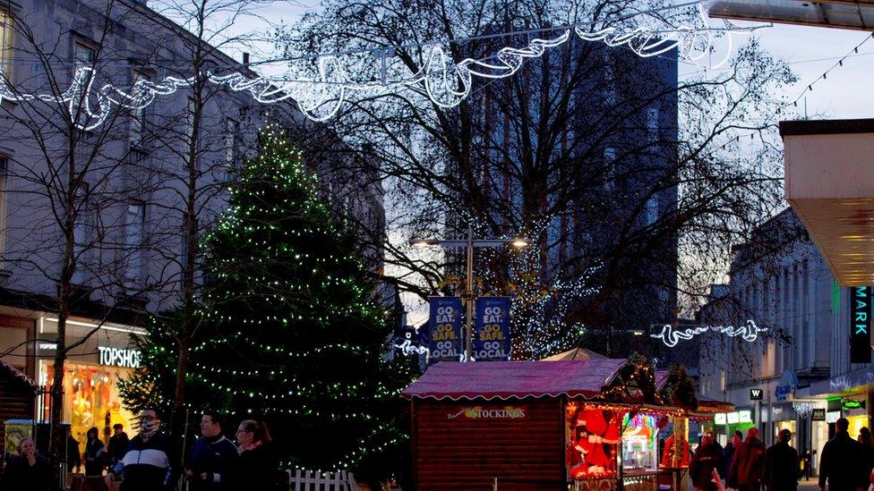 Christmas tree with lights, and over head street lights, in Portsmouth